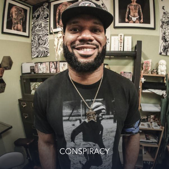 Lance Kendricks, NFL Player wearing Room101 x Chuey Quintanar Pendant and Conspiracy text